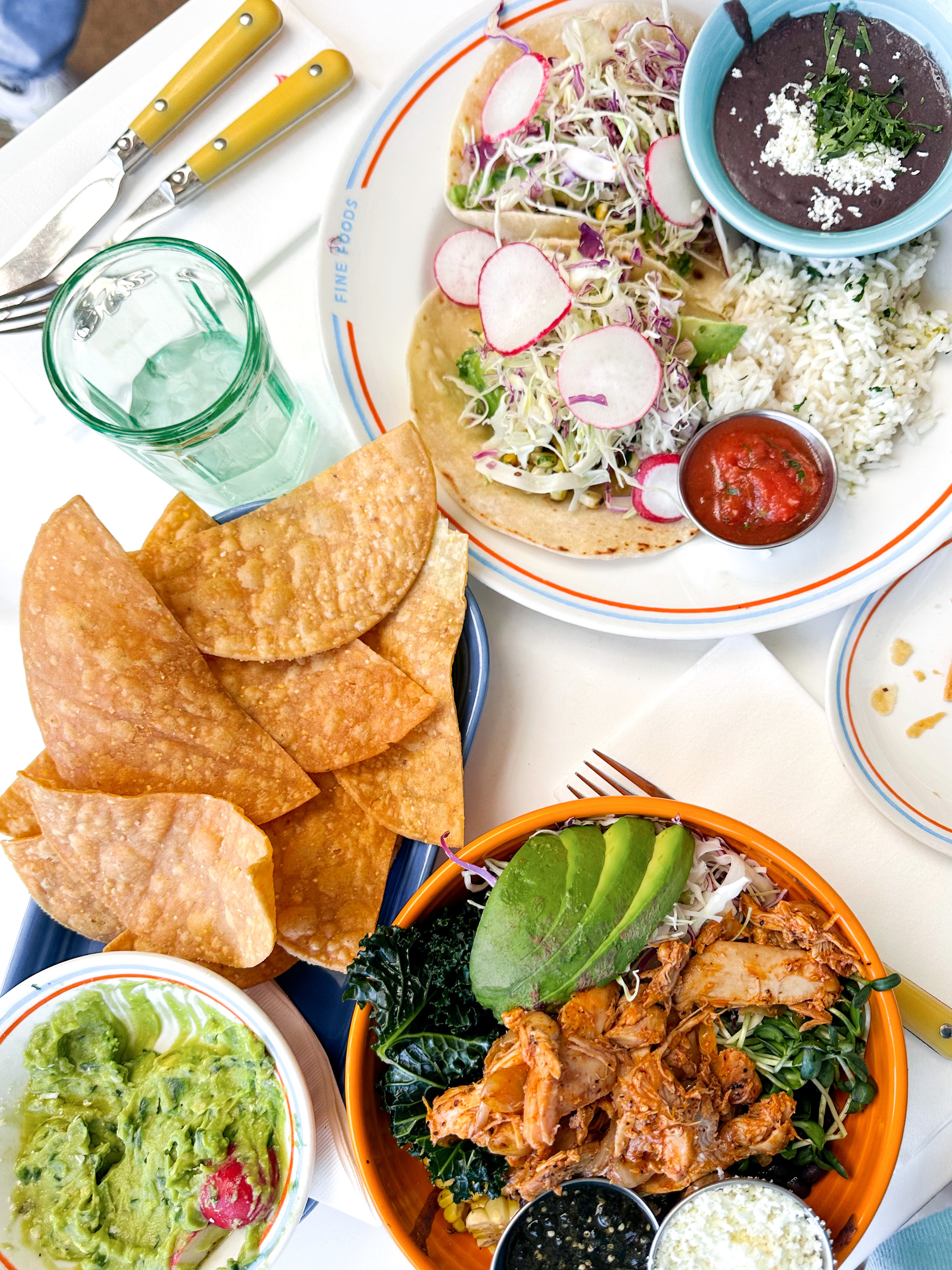 A loaded bowl with chips and fresh guacamole