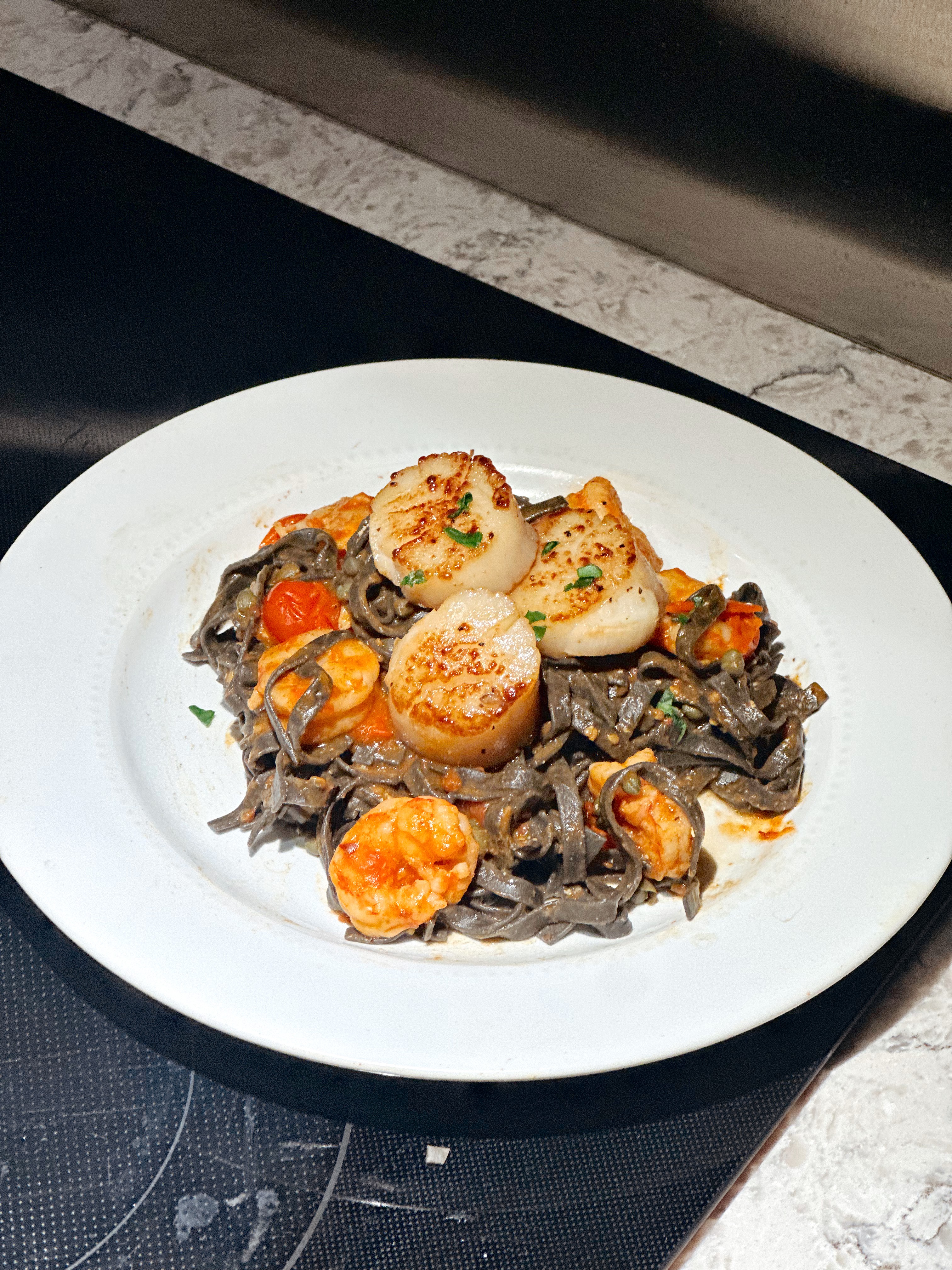 Seared scallops over pasta