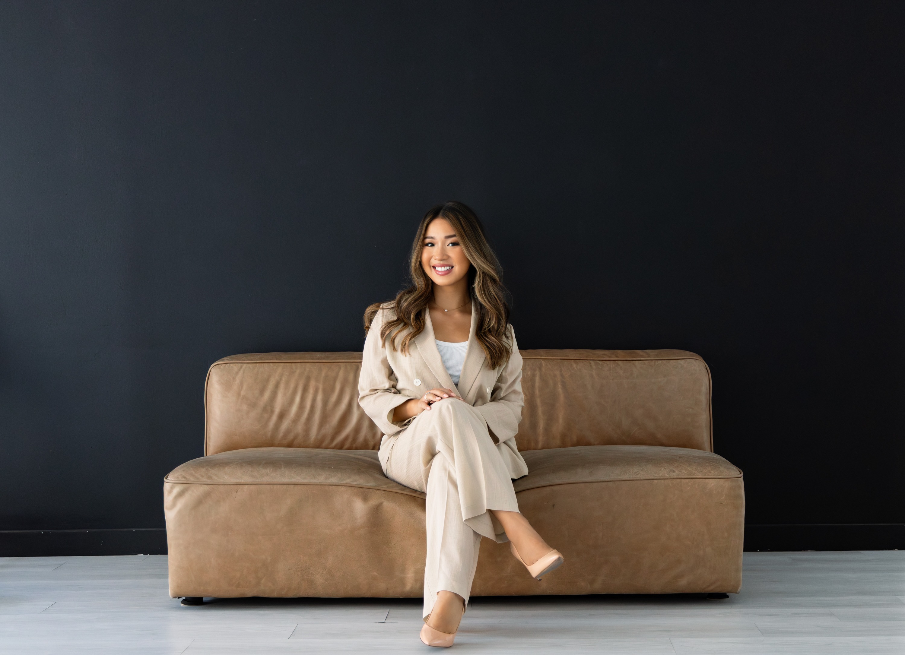 Katie Hoang, portrait on a couch